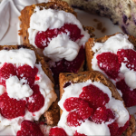 photo of blueberry buckle shortcake variation with whipped cream and raspberries